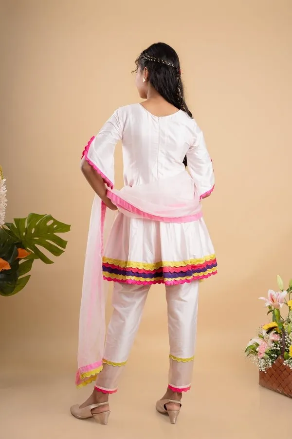 Charming white kurta set with colorful scalloped details and floral embroidery, perfect for festive occasions